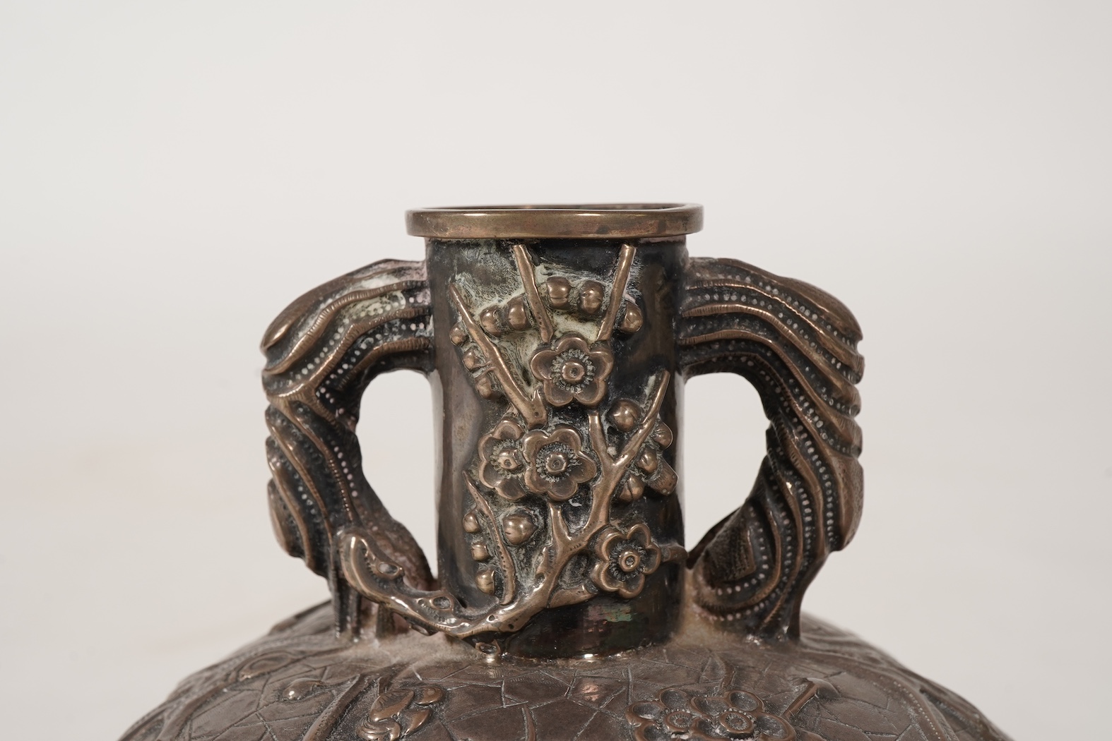 A pair of late 19th/early 20th century Chinese Export white metal two handled globular vases, by Wang Hing, Hong Kong